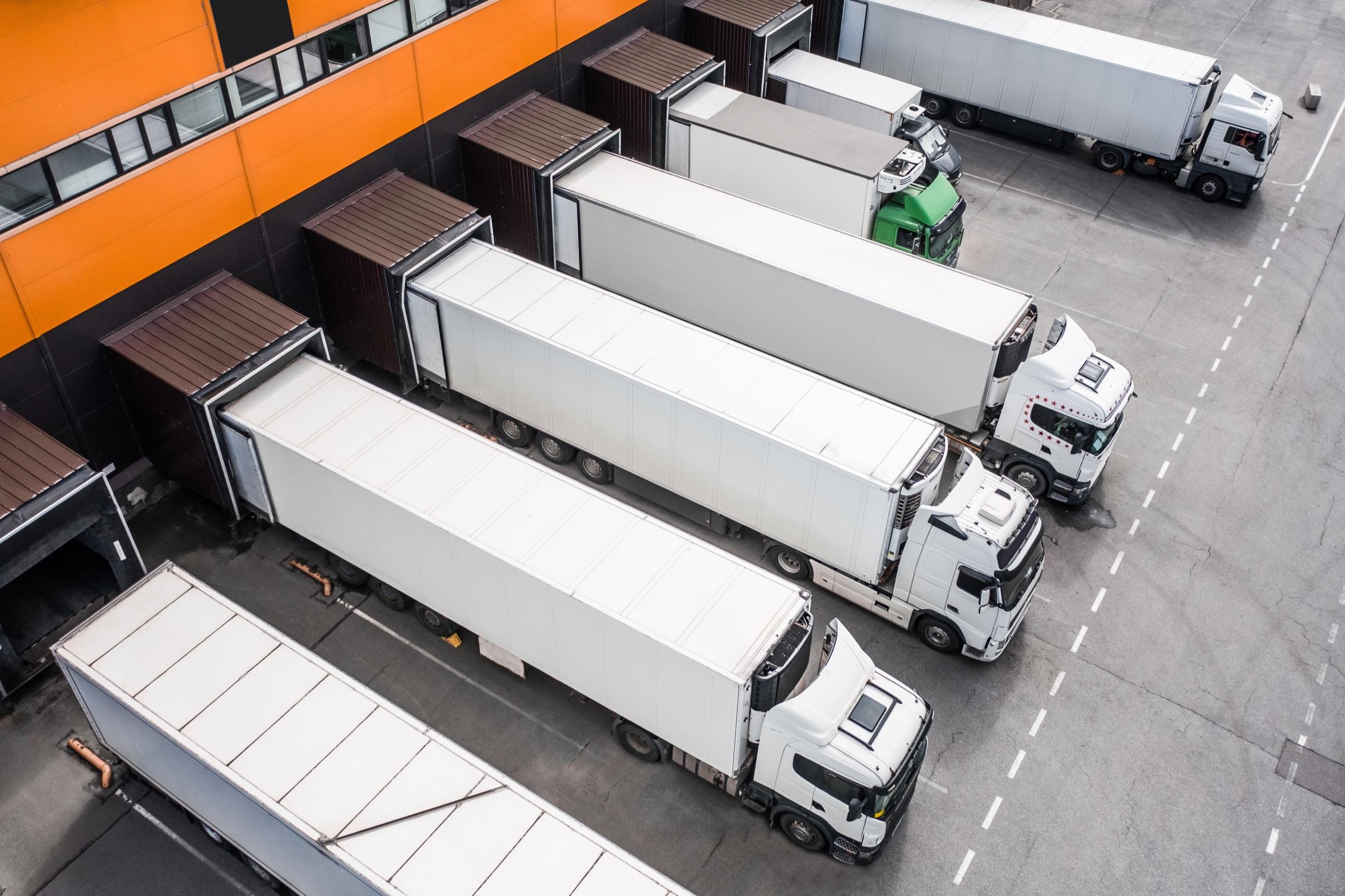 Refrigerated trucks at a distribution hub